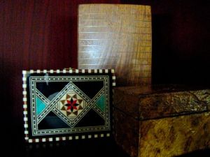 3 decorated boxes - left a gift from a Spanish friend; top, wood enlaid with brass from import store, northern california; right textured paper(?) from northern california import store