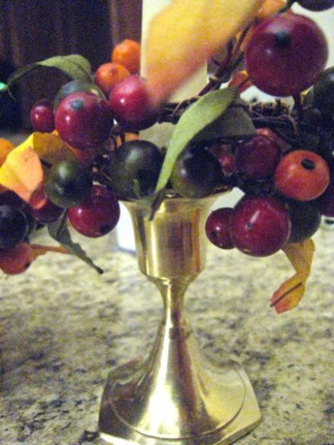 favoured autumnal candle decoration with a polished brass holder